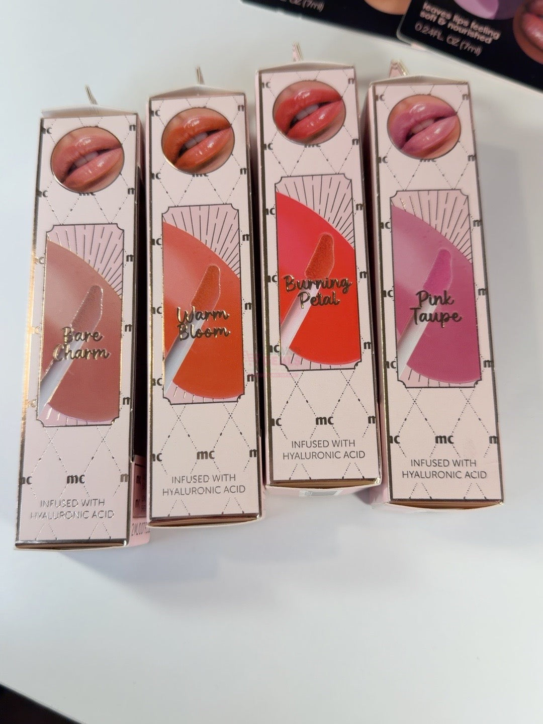 Marie Claire Glossy Lip Tint shade guide: Bare Charm, Warm Bloom, Burning Petal and Pink Taupe, left to right